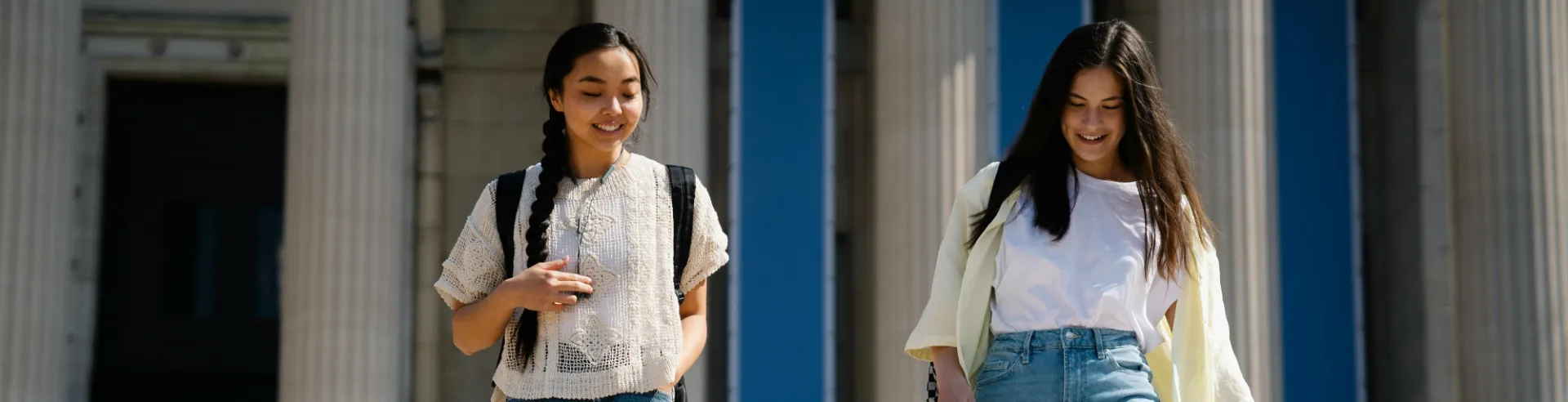 Students walk in front of low library