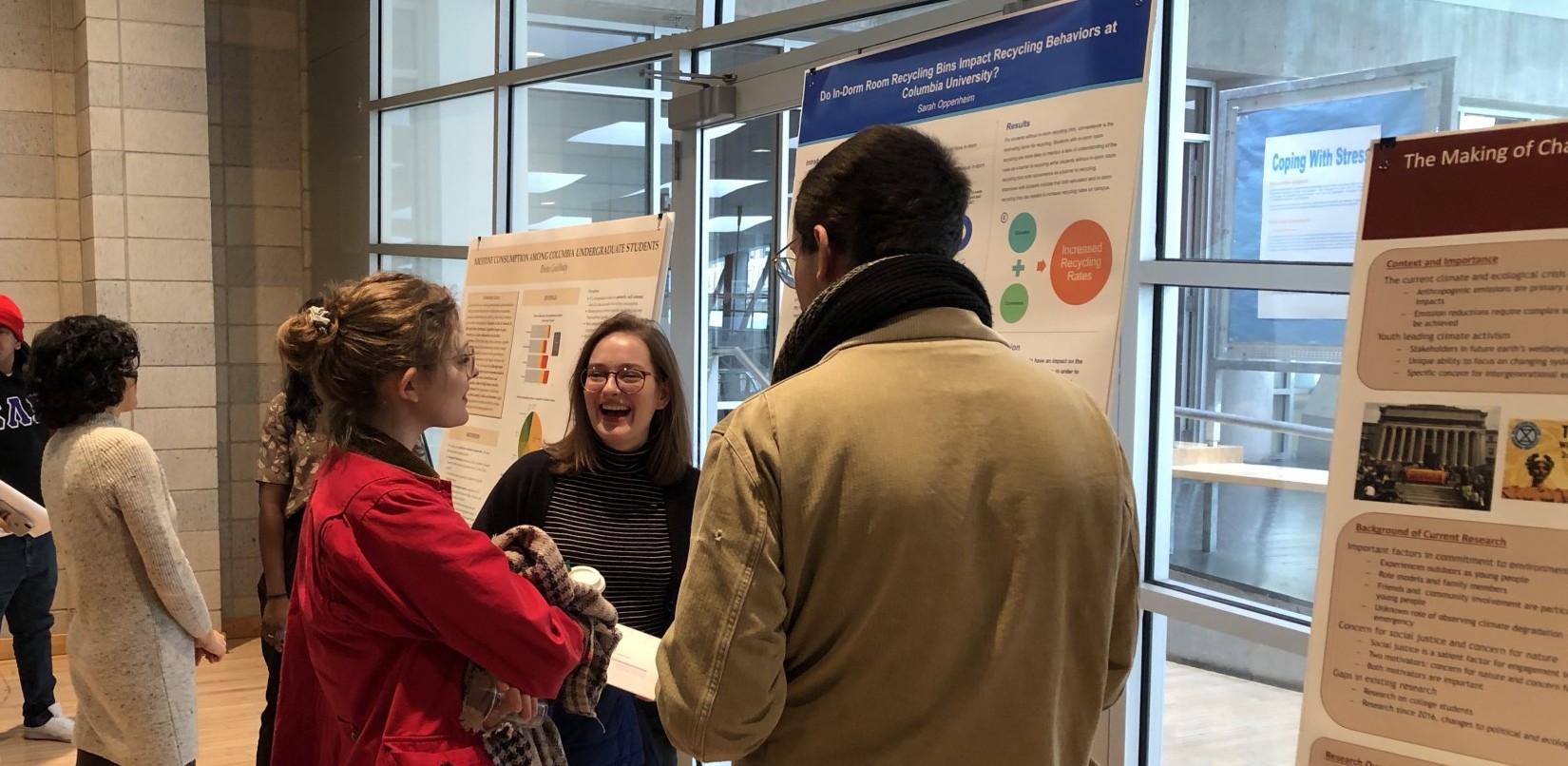 Students chat at a poster session